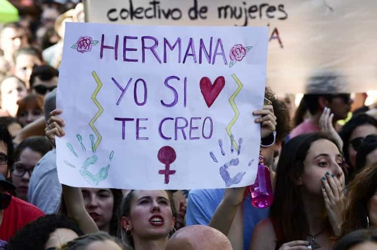 A+woman+holds+a+placard+reading+Sister%2C+I+believe+you%2C+during+a+demonstration+in+Madrid+on+June+22%2C+2018%2C+a+day+after+a+court+ordered+the+release+on+bail+of+five+men+sentenced+to+nine+years+in+prison+for+sexually+abusing+a+young+woman+at+Pamplonas+bull-running+festival.+%0A%0AThe+men%2C+who+called+themselves+the+pack+in+a+WhatsApp+messaging+group%2C+had+been+accused+of+raping+a+woman%2C+then+18%2C+at+the+entrance+to+an+apartment+building+in+Pamplona+on+July+7%2C+2016%2C+at+the+start+of+the+week-long+San+Fermin+festival%2C+which+draws+tens+of+thousands+of+visitors.+%2F+AFP+PHOTO+%2F+JAVIER+SORIANO