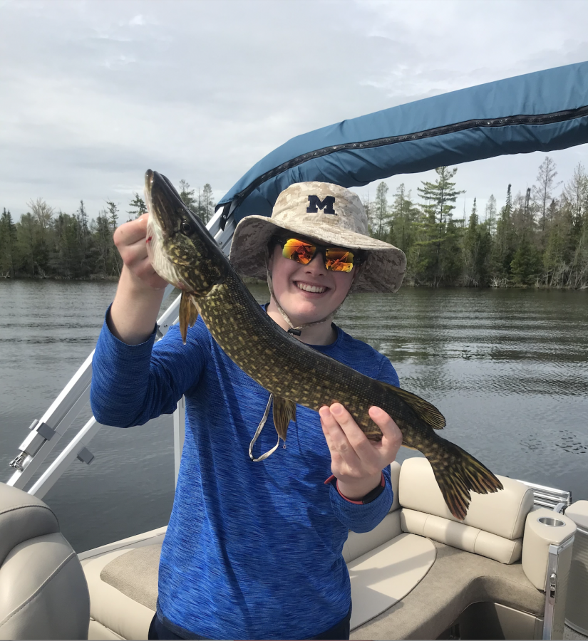 Timmy poses with a recent catch: northern pike.