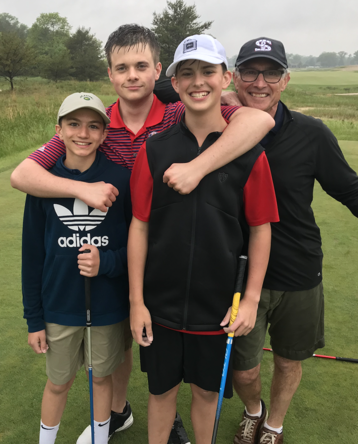 Senior and Masters pool champion Thor Graham playing golf with other participants, sophomore Leo Romano and Middle School math teacher Jeff Newmark.