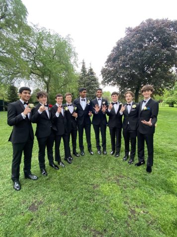 Seniors hold up their final ranking in their fantasy football league at Prom 2022.