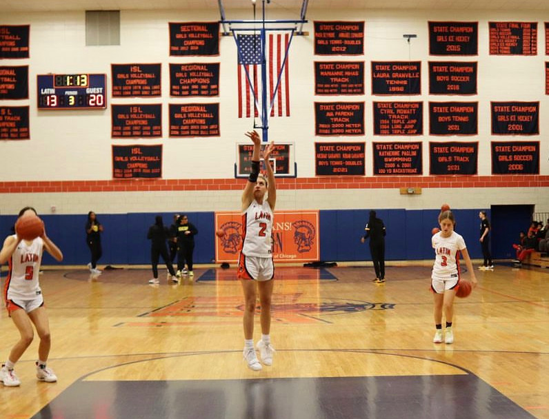 Junior McLean Moroney shooting a free throw before a game in the Field Gym.