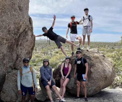 Seniors Kiran Garapati, Max Liss, Julia Mann, Akili Parekh, Max Pohl, Domenic Sacchetti, and Anton Schuster pause on their mountain bike ride.