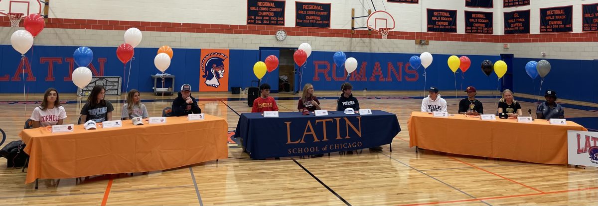 Senior athletes gather in Latins Field Gym to commemorate their college athletic commitments.