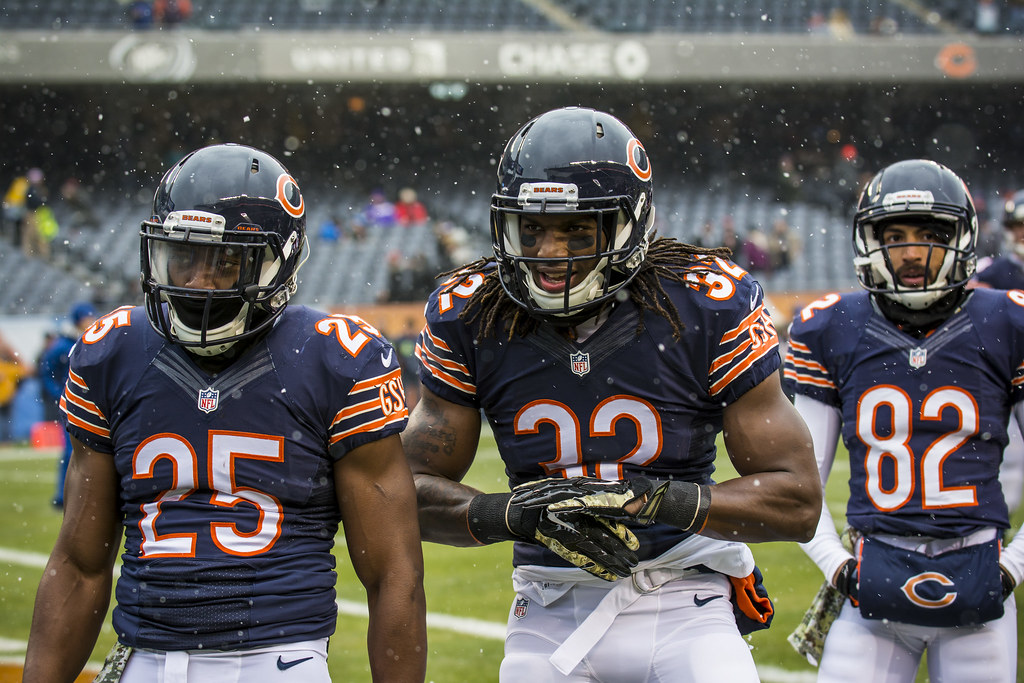 Bears+players+look+on+at+Soldier+Field+on+a+snowy+day.