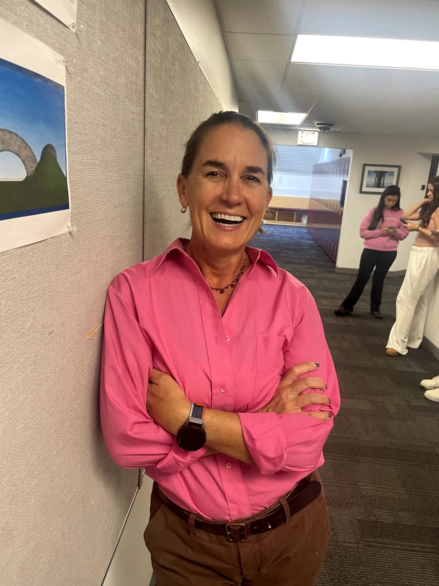 Upper school math teacher Michelle Neely wears a pink button-down shirt to celebrate Spirit Week.