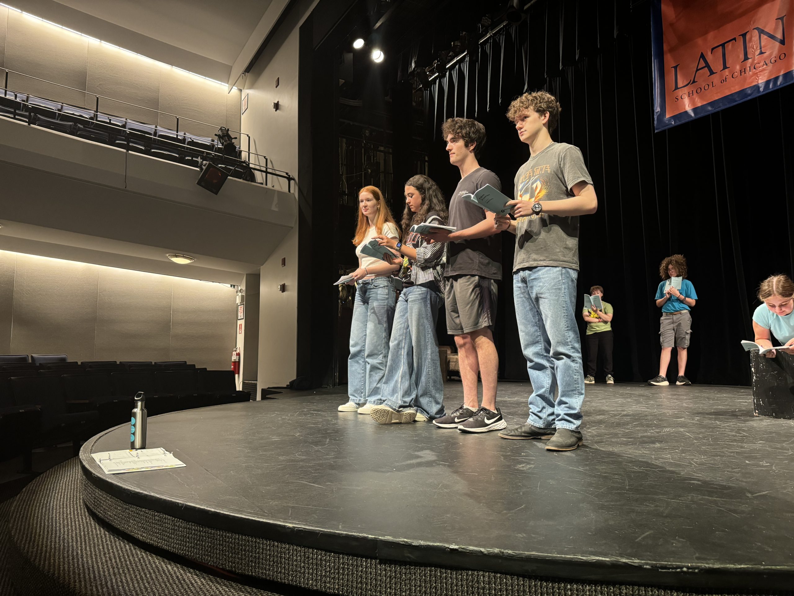 Actors on stage during rehearsal of "Failure: A Love Story."