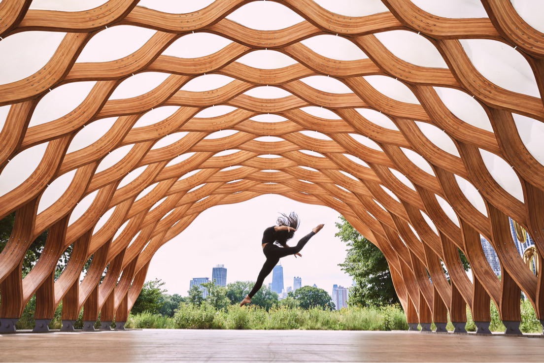 Sara Cutinho leaps across Chicago skyline.