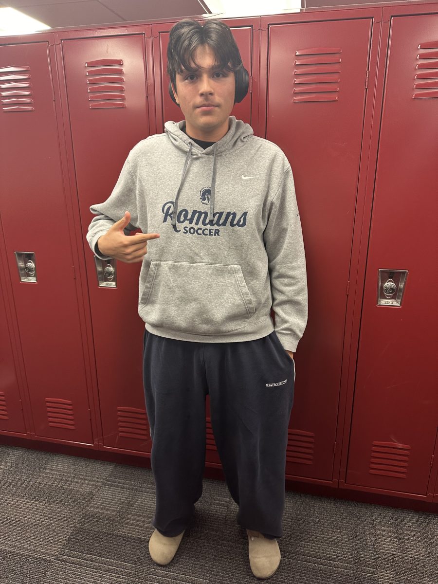 Diego Delira, Athlete of the Week, hanging out in a locker bay.