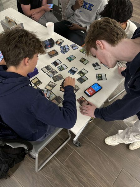 Seniors Miles Daly and Nico Thom engage in a game of Magic: the Gathering.