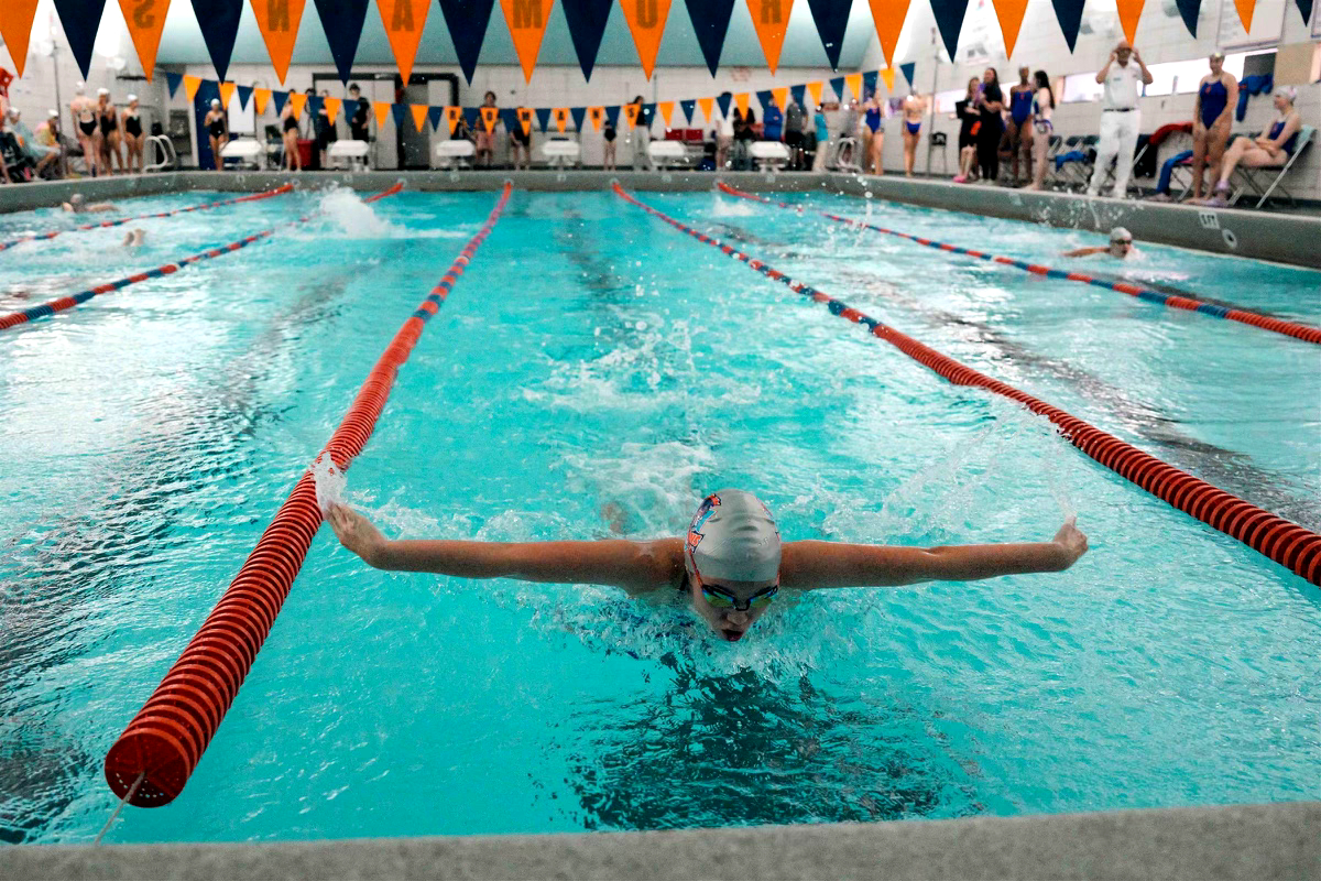 Greta Temple swims a butterfly race.