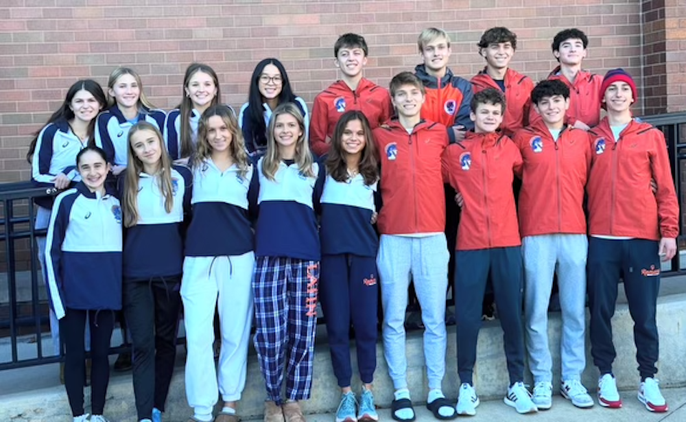 Latin's boys and girls cross country teams gather at school before embarking on their journey to the State championship meet.