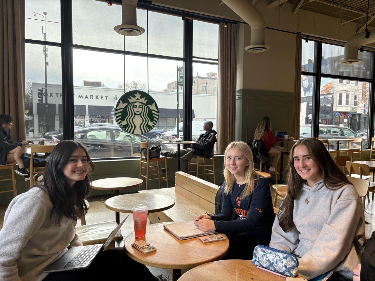 Sophomores Lily Dumas, Myla Robertson, and Genevieve Ramsey working and hanging out at Starbucks.