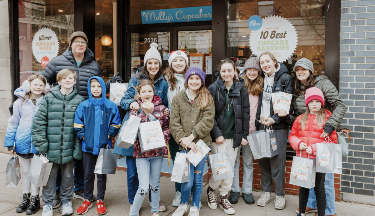 Families and friends celebrating with bags of cookies in hand 