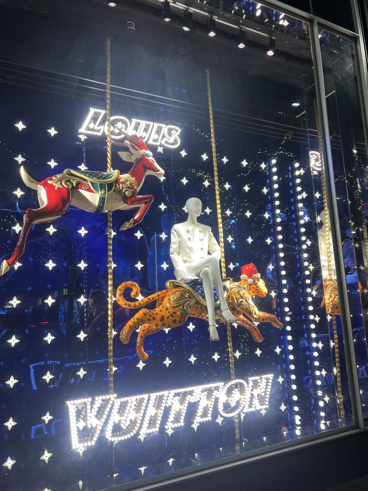 Louis Vuitton store window decorated for the holidays.