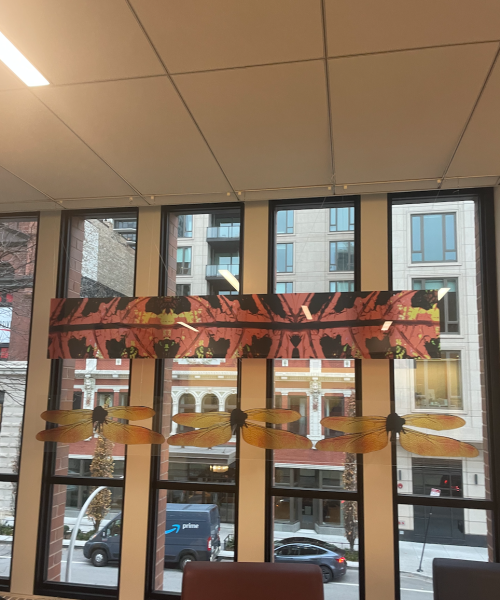 Prints hanging from the ceiling on the second floor of the Upper School.