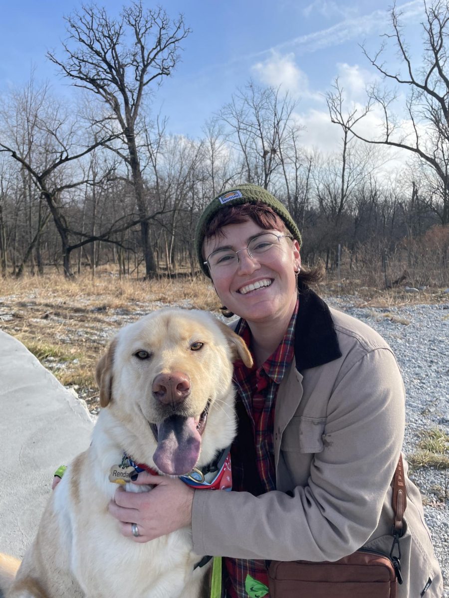 Mx. Hansberry on a nature walk with their dog, Rendar.