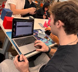 Senior Cristiano Tricoci looks through his Maia account, a college application dashboard.