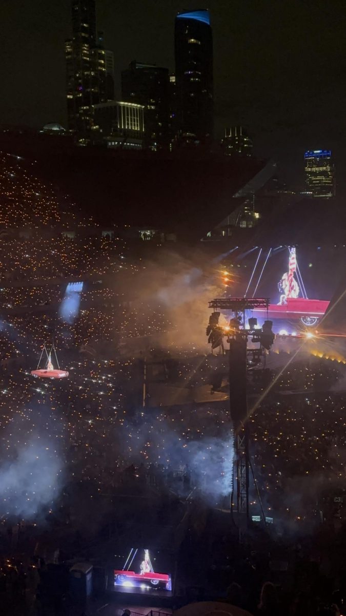 Beyoncé in a car soaring over Soldier Field singing "16 CARRIAGES"