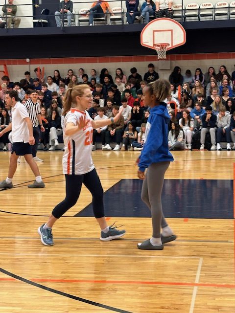 Debbie Linder (left) and Cali King (right) in the student-faculty basketball game, an event organized by student government.