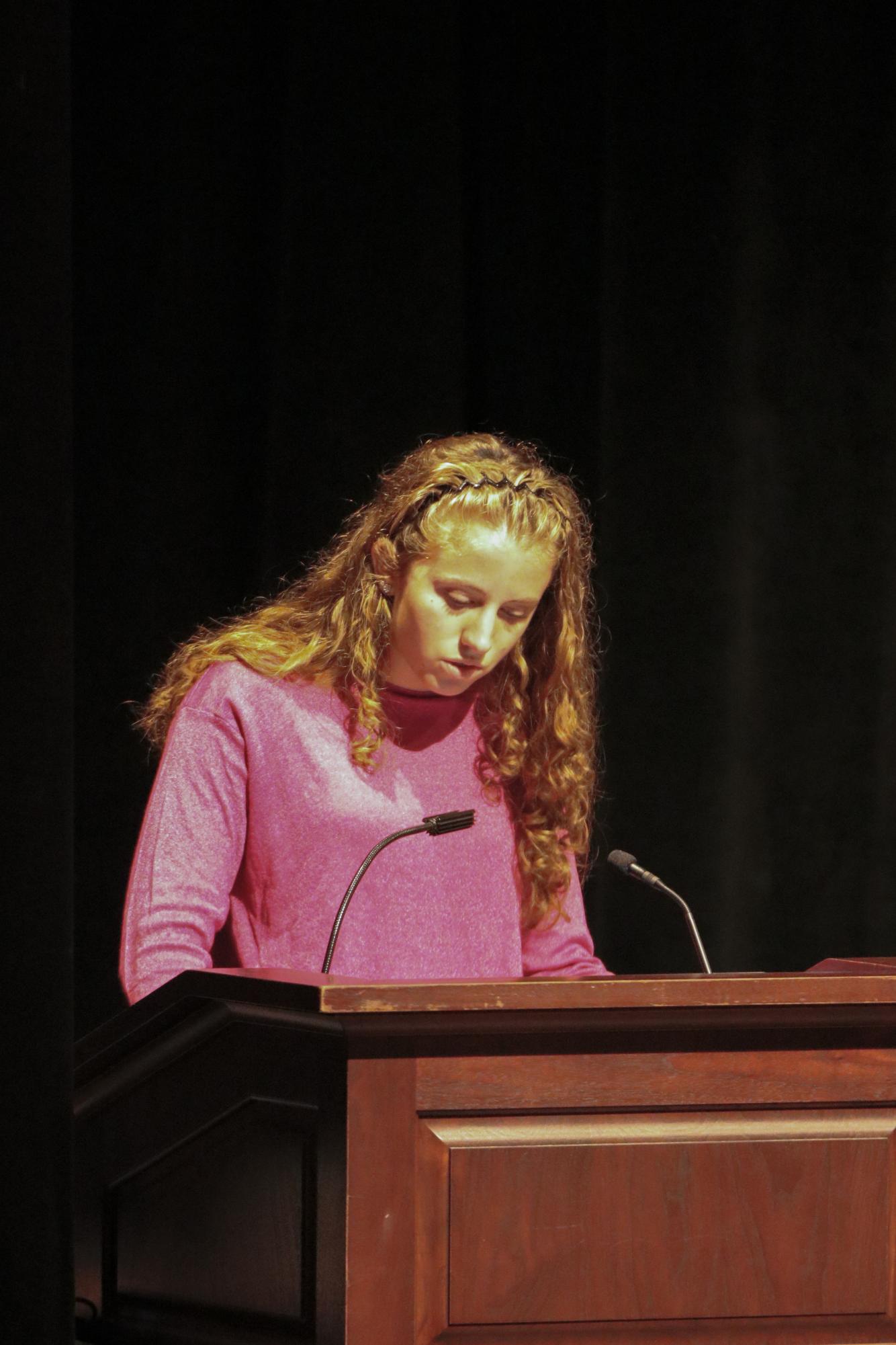 LASO co-head and senior Sydney Dibble informs the Upper School of ongoing ICE raids in Chicago.