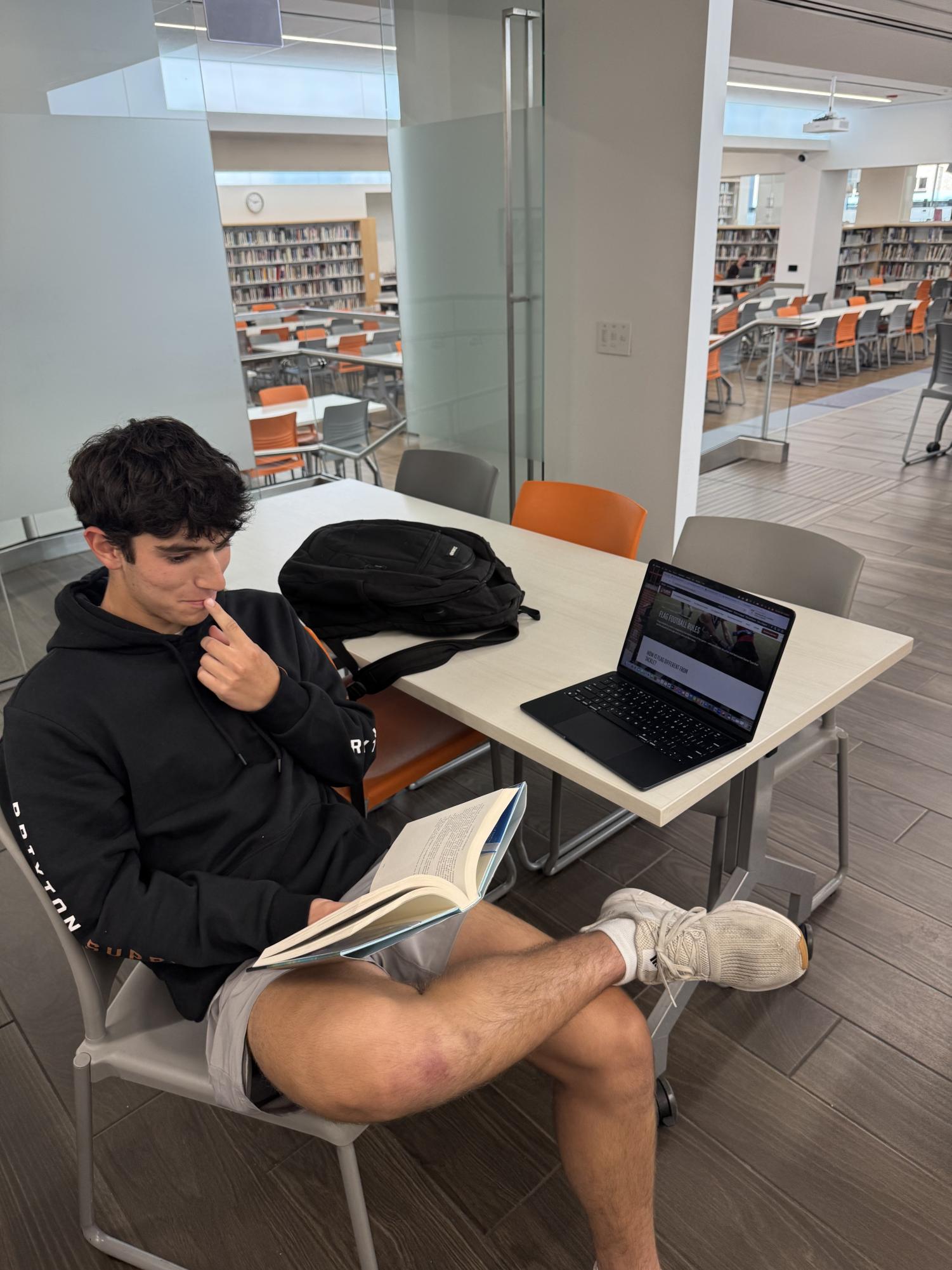 Latin senior Josh Solovy plans for the Latin-Parker flag football game.