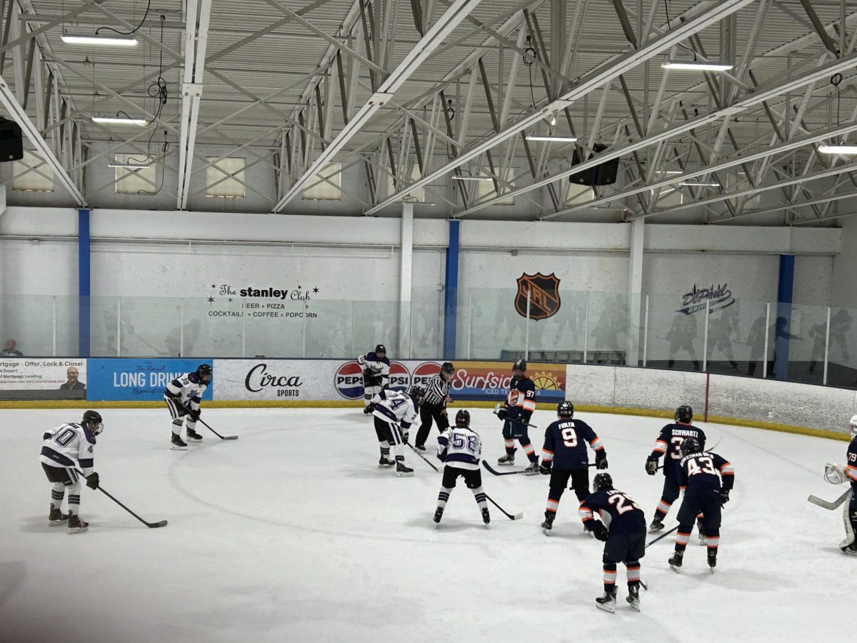 Chicago Central Hockey Club and Kings Hockey Club line up for a face-off.