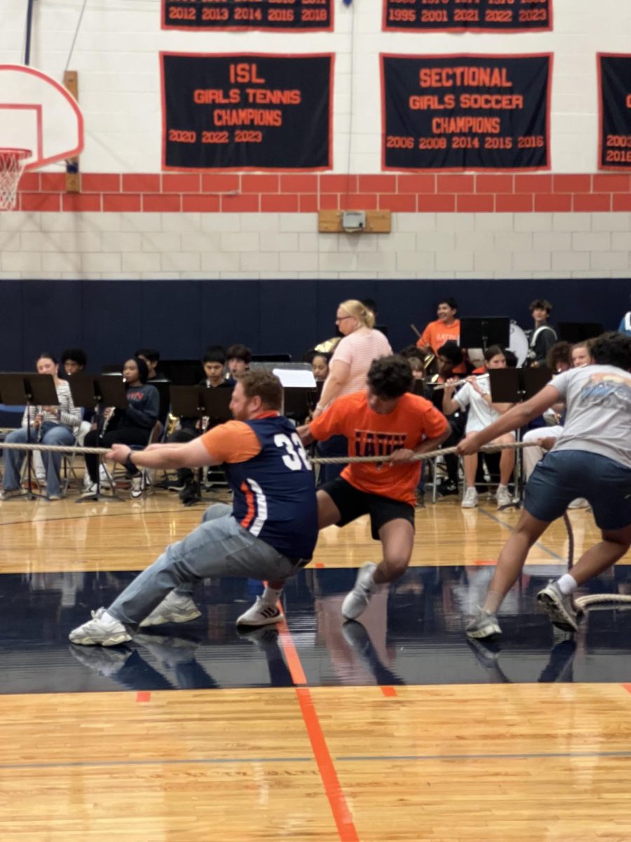 Powerful Dean Lenny Goldman gives maximum effort to help the freshmen in tug of war.