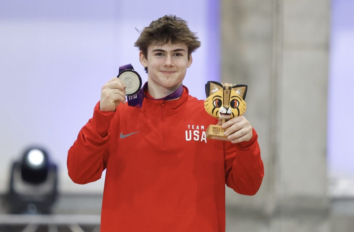 Bo stands proudly on the podium with silver medal in the vault.