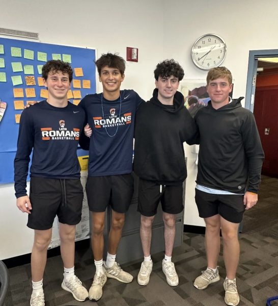Seniors Mitchell Leavitt, Gabe Swanson, Miles Heltzer, and Jack Zeiger participate in Twin Day by wearing matching outfits.