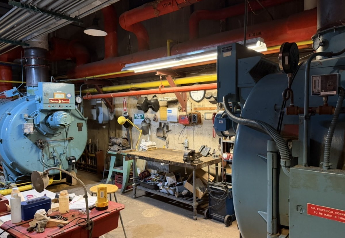 Mechanicals and a facilities workbench in the Upper School basement