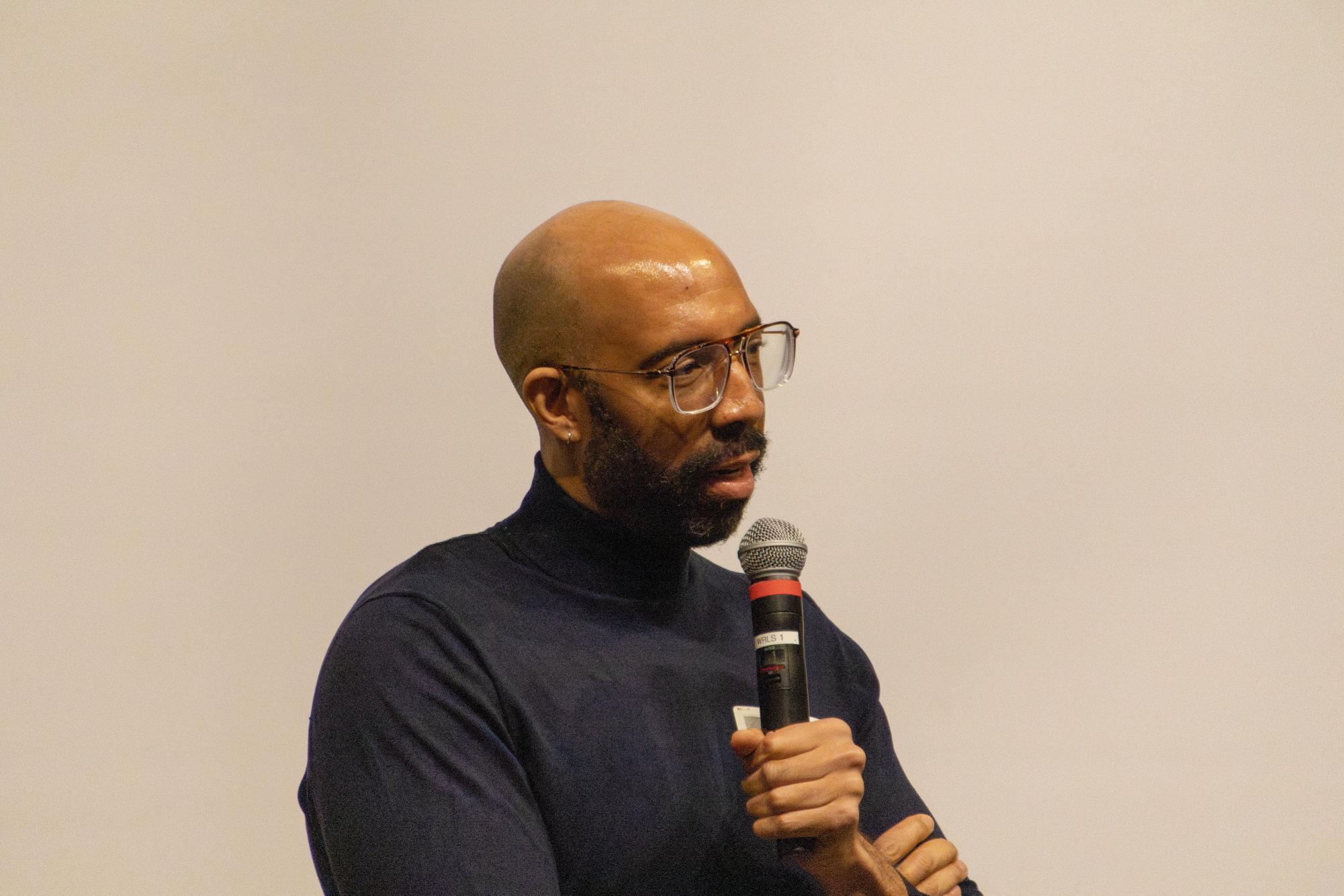 Guest speaker Damien Geter talking to Upper School students and faculty during the MLK Day of Commemoration assembly.