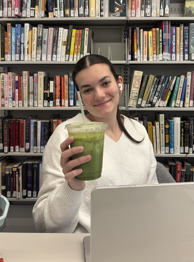 Junior Fabi Vallenilla holding the kiosk's new matcha.