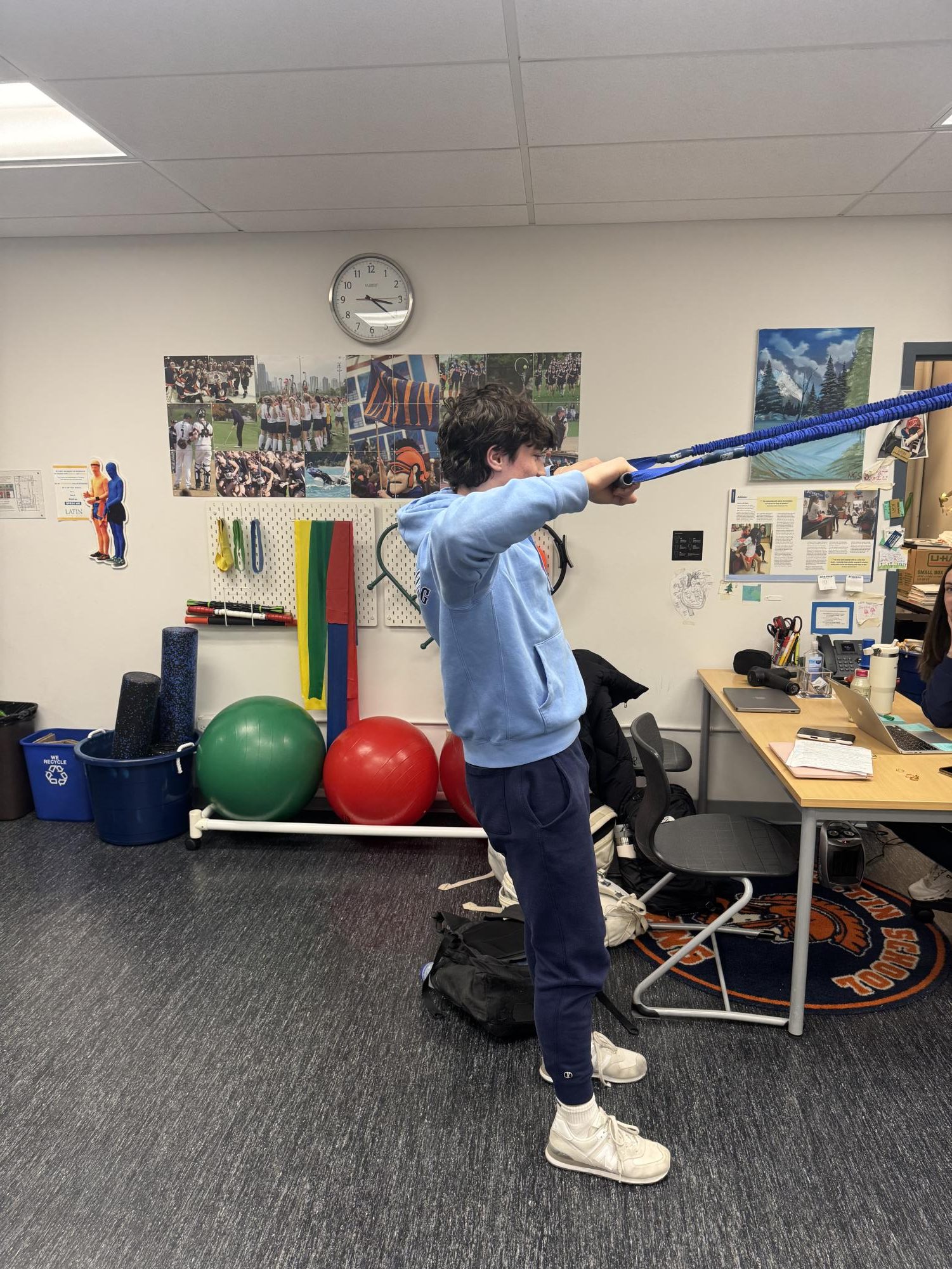 Senior Grayson Hoffman stretching in the athletic trainers' office.