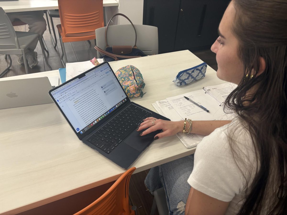 A Latin junior looks over her Earned Honors paragraph.