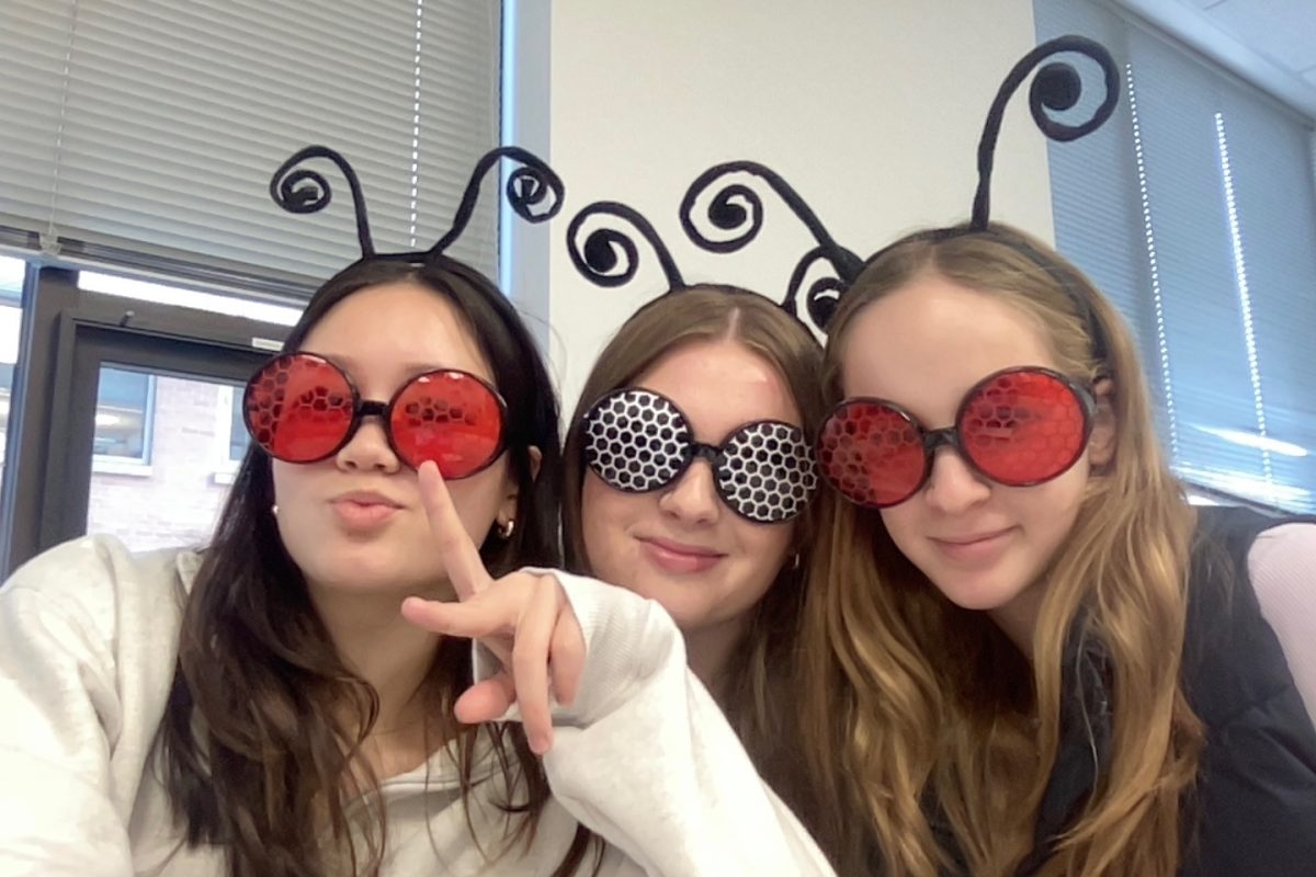 Members of Honors Research in Molecular Genetics Avery Hellweg, Caitlin Creevy and Lucia Meno pose for a photo.