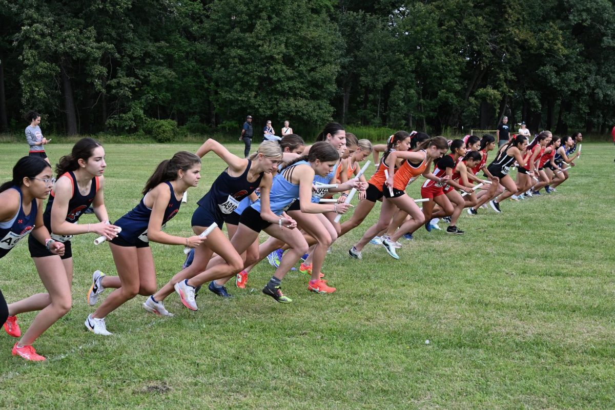 Members of the girls cross country team begin a race.