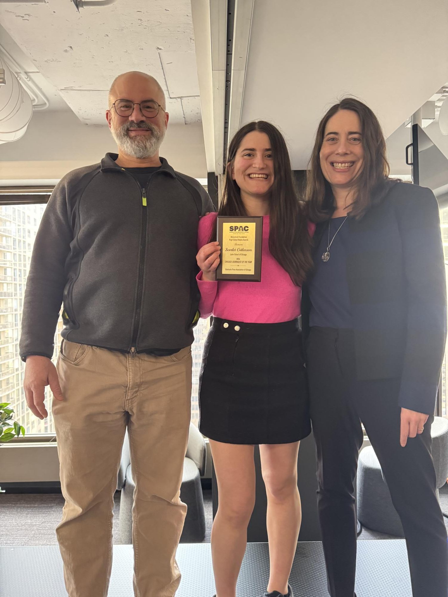 Scarlet Gitelson, flanked by her proud parents, Josh Gitelson and Hari Osofsky, displays her Chicago Journalist of the Year award.