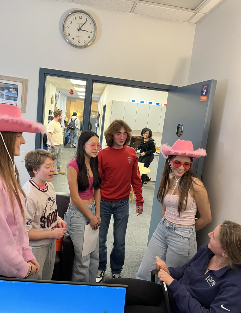 Students sing to Upper School Dean and science teacher Amy Merrell.