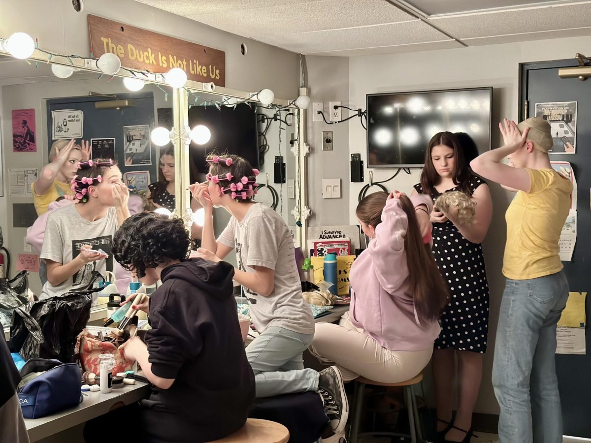 Members of the "Anything Goes" cast get ready for the show.