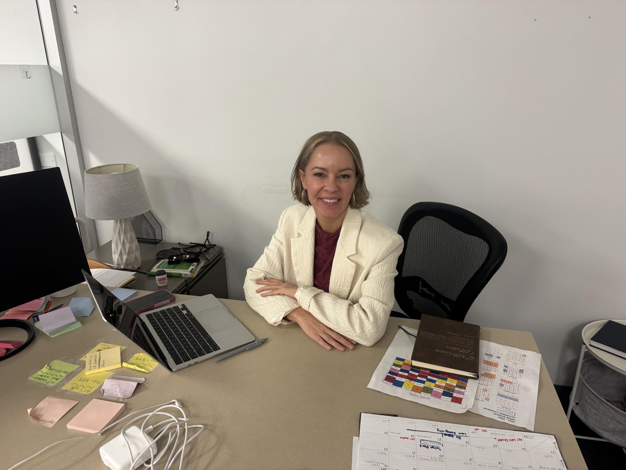 Sarah Lawrence sits at her desk in the Learning Resources room.