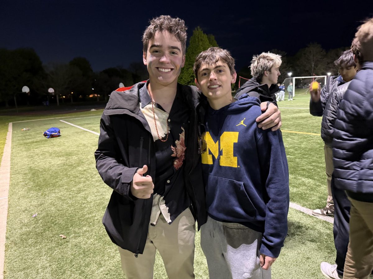 Alex and Arlo stand together at Field Day Frenzy. 