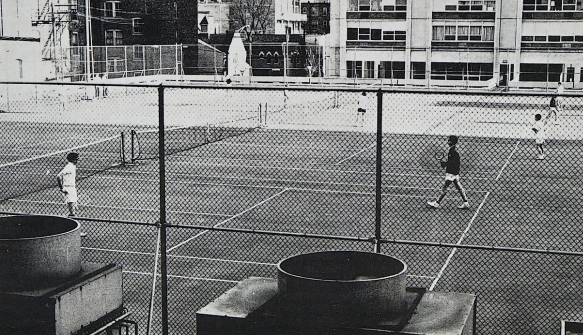 Tennis team practicing on Sandburg courts 