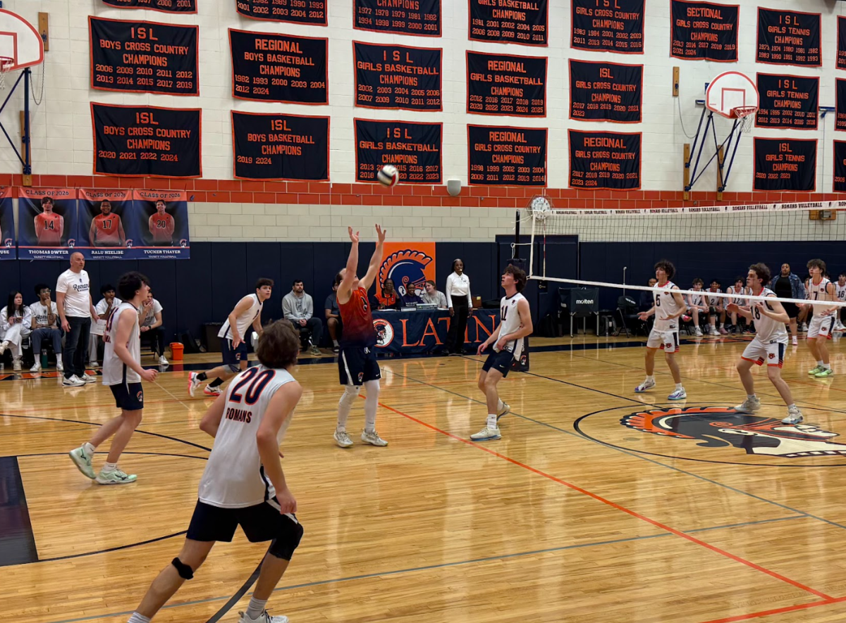 Senior Andrew Legendre prepares to set the ball.