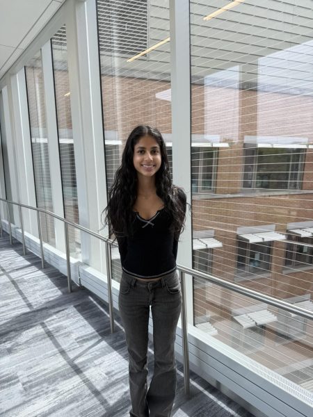 Ani Mehta-Shah stands on the Science Center bridge.