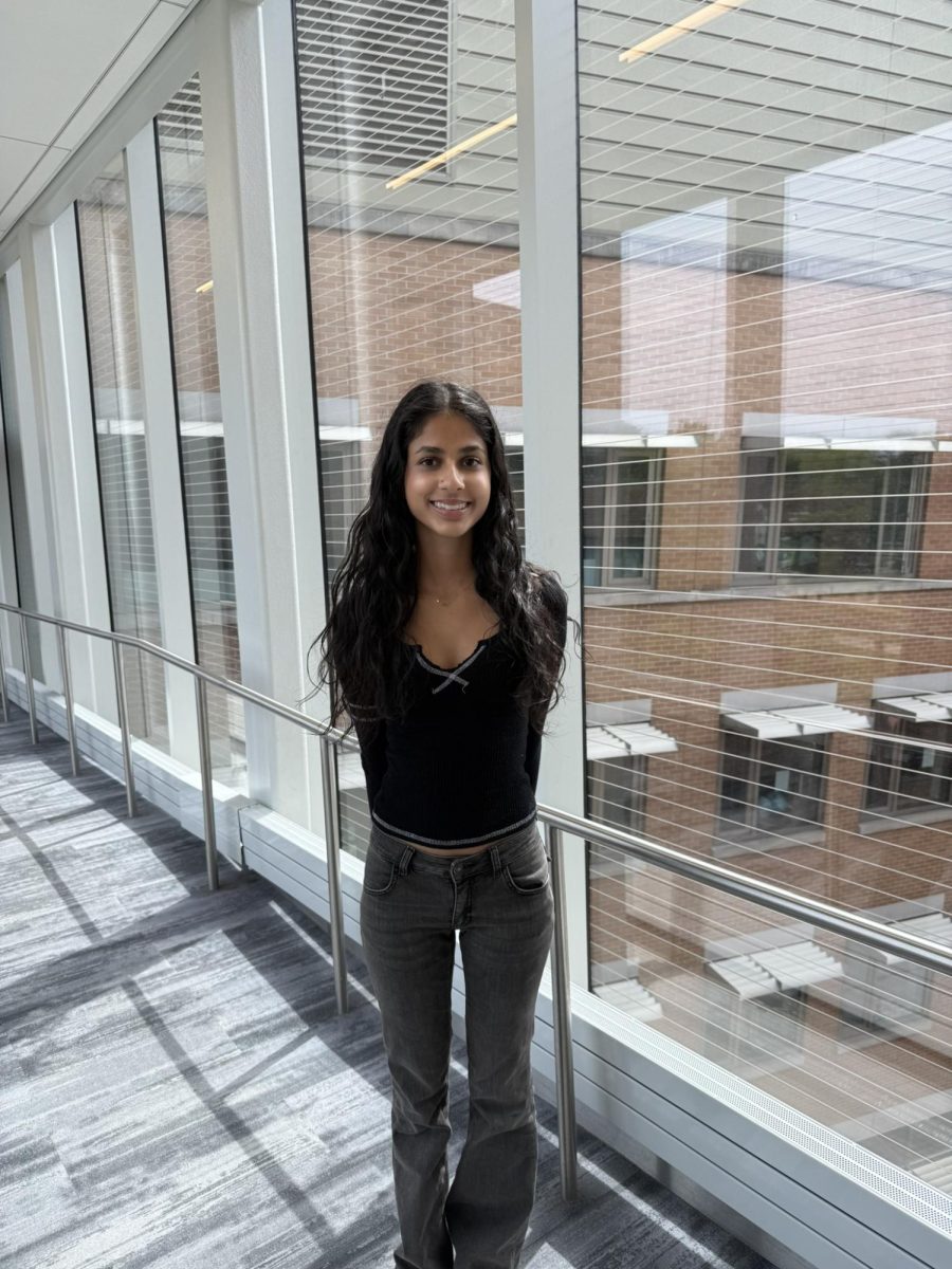 Ani Mehta-Shah stands on the Science Center bridge.