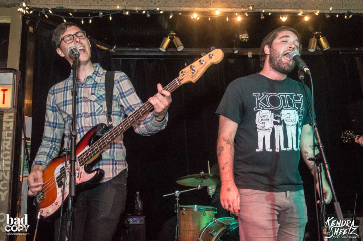 Upper School English teacher James Joyce (left) sings and plays bass guitar during a show in 2017.