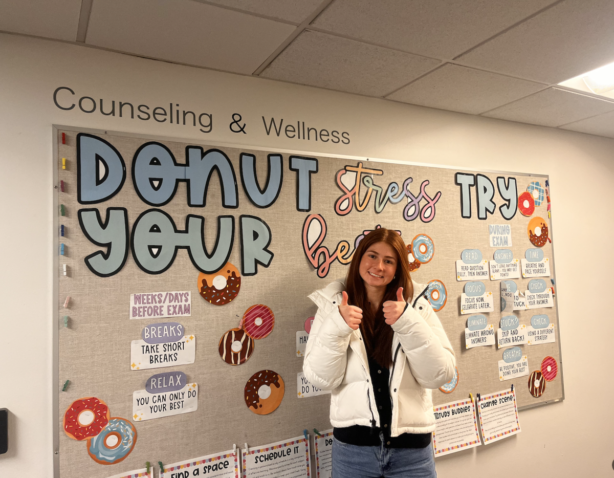 Junior Eliza Goldhaber taking in all of Ms. Knoche's advice before her exam.