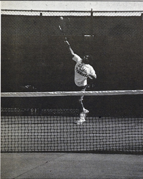 Senior Prefect Larry Kamin serves a crucial point into the deuce court. Larry played on the tennis team all four years of his high school career. This season, Larry played second singles. 